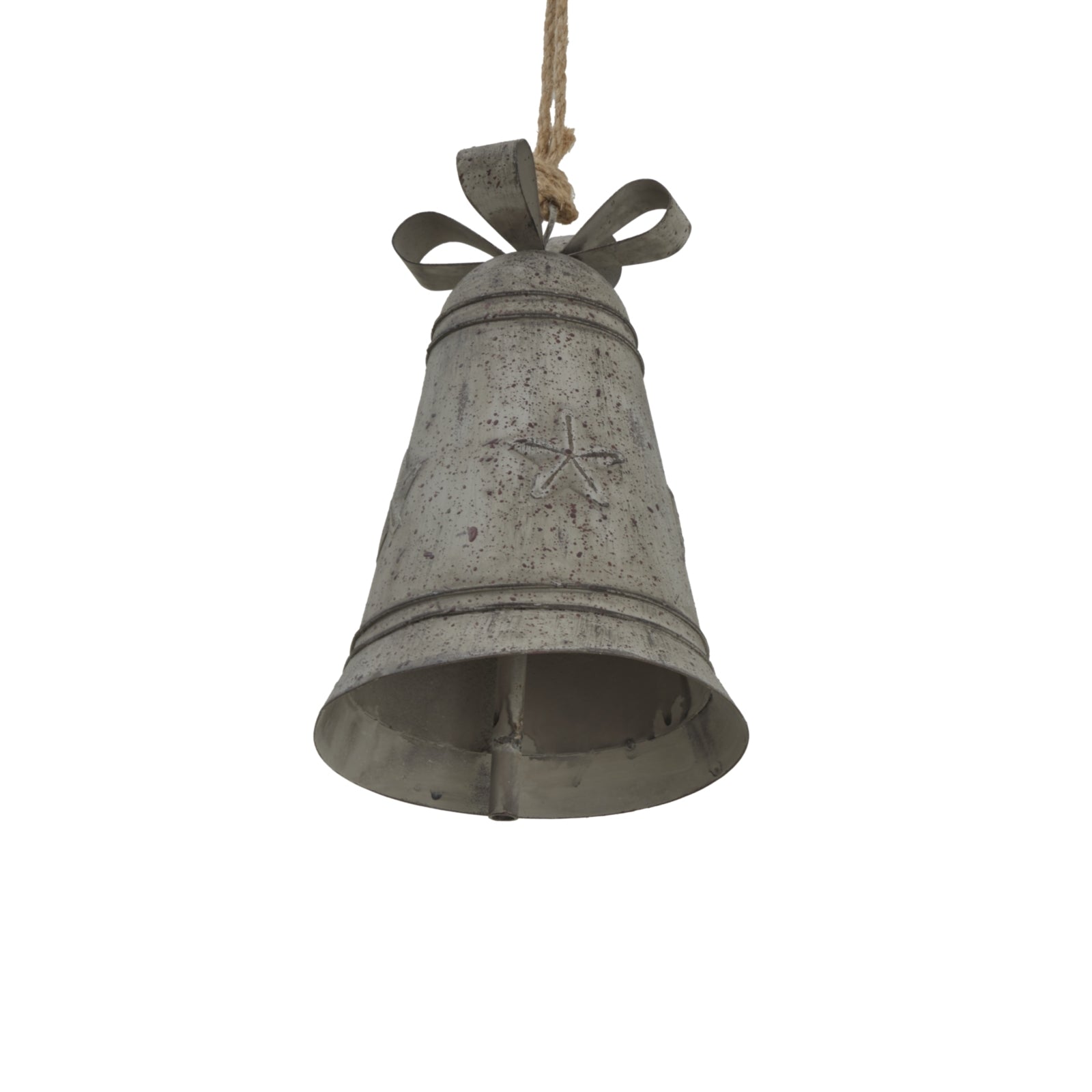 a soft-lit rustic white metal bell with a delicate bow, resting gently on a textured surface