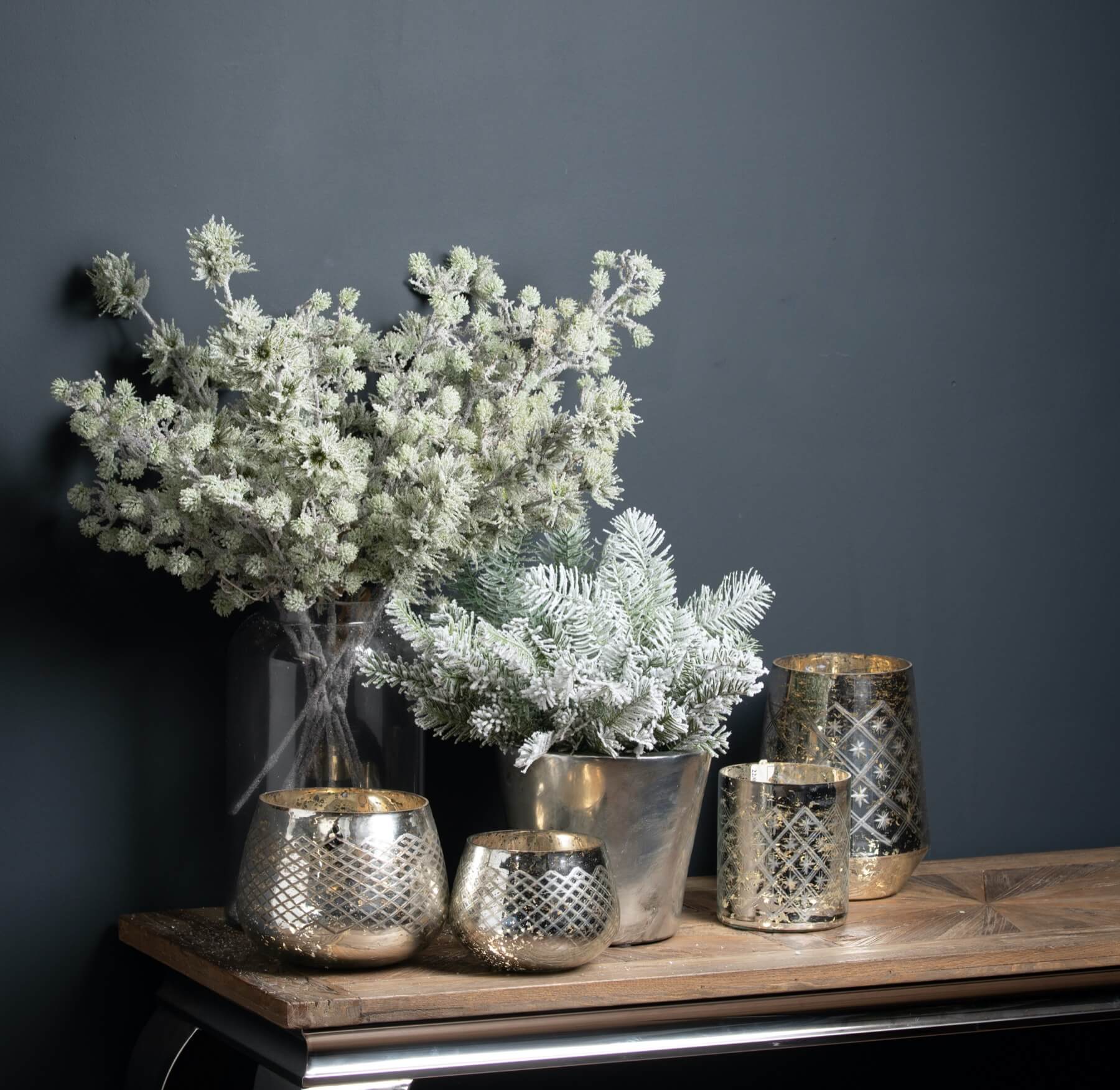 Handcrafted snow branch with lifelike frost details, crystalline accents, and realistic plastic texture for winter decor. by sostter at brixbailey.com