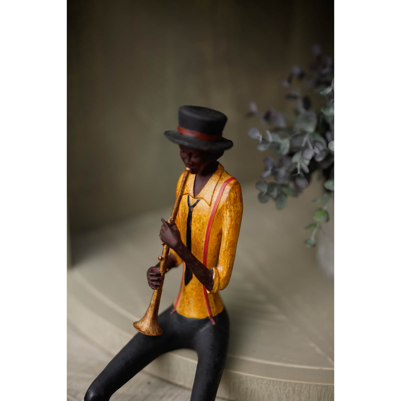 Handcrafted jazz trumpeter sculpture in rich brown resin, 39cm tall, vintage jazz band decor by Sostter at brixbailey.com