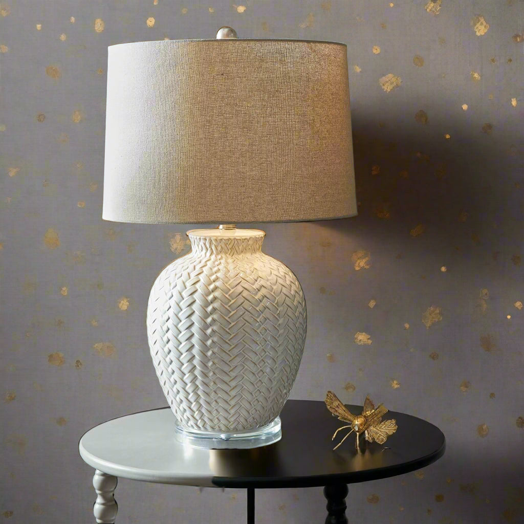 Handcrafted white ceramic table lamp with twill weave texture and linen shade for warm ambient lighting by Sostter at brixbailey.com