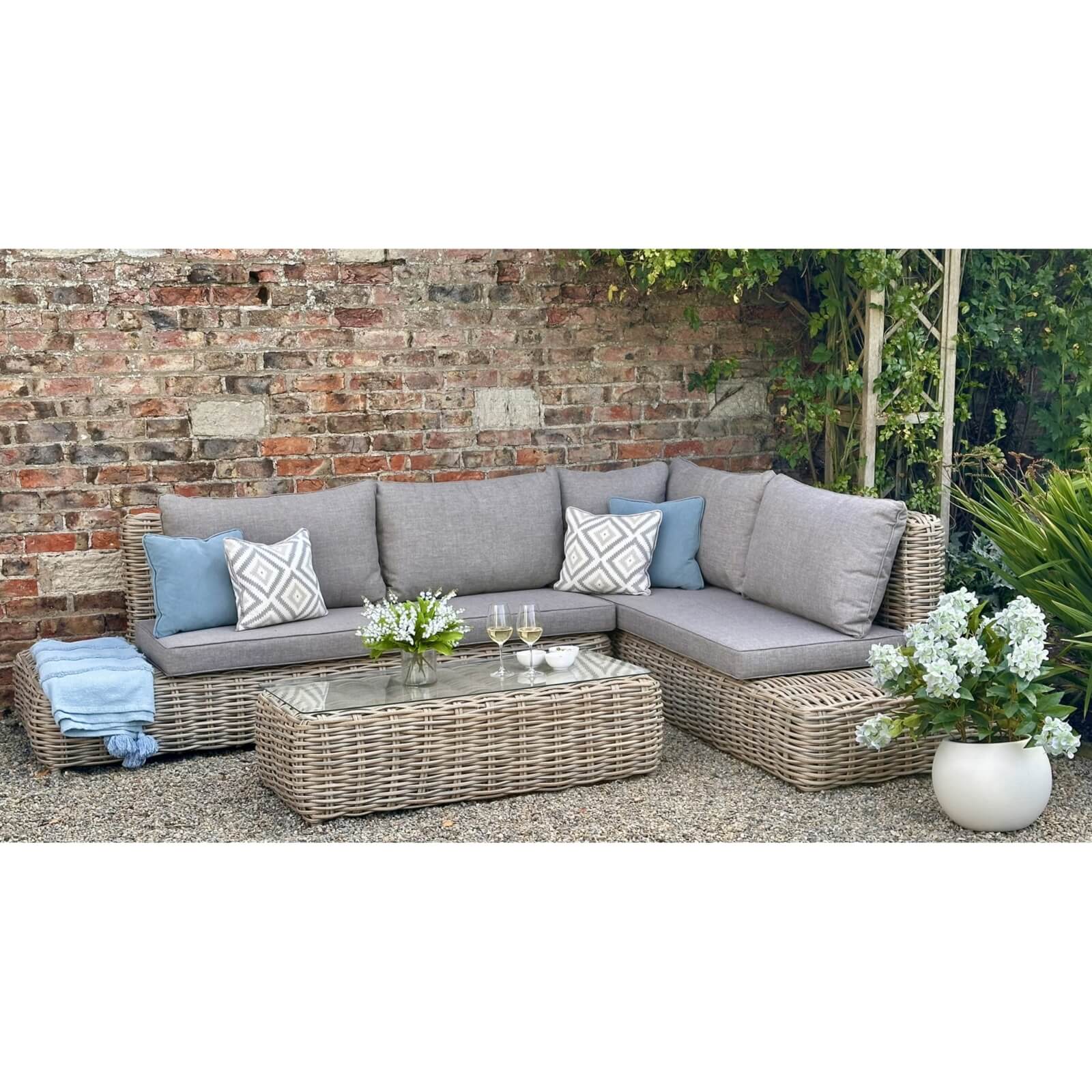 Beige tempered glass display unit with modular left (212cm) and right (219cm) sections, matching table by RoomLondon at brixbailey.com