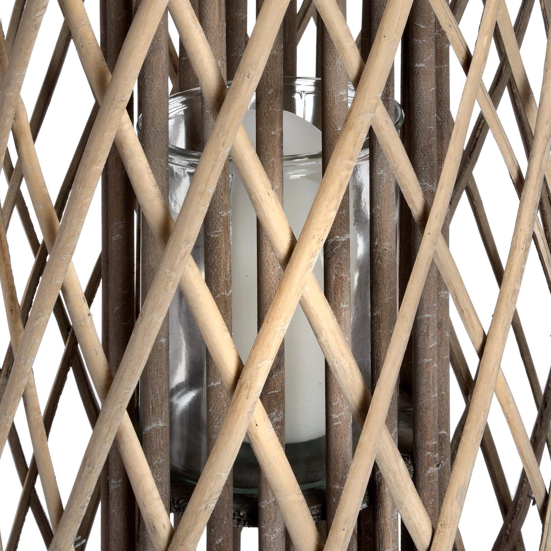 Handwoven rattan lantern with intricate natural weave, rich brown color, casting warm light patterns for indoor or outdoor decor. by sostter at brixbailey.com
