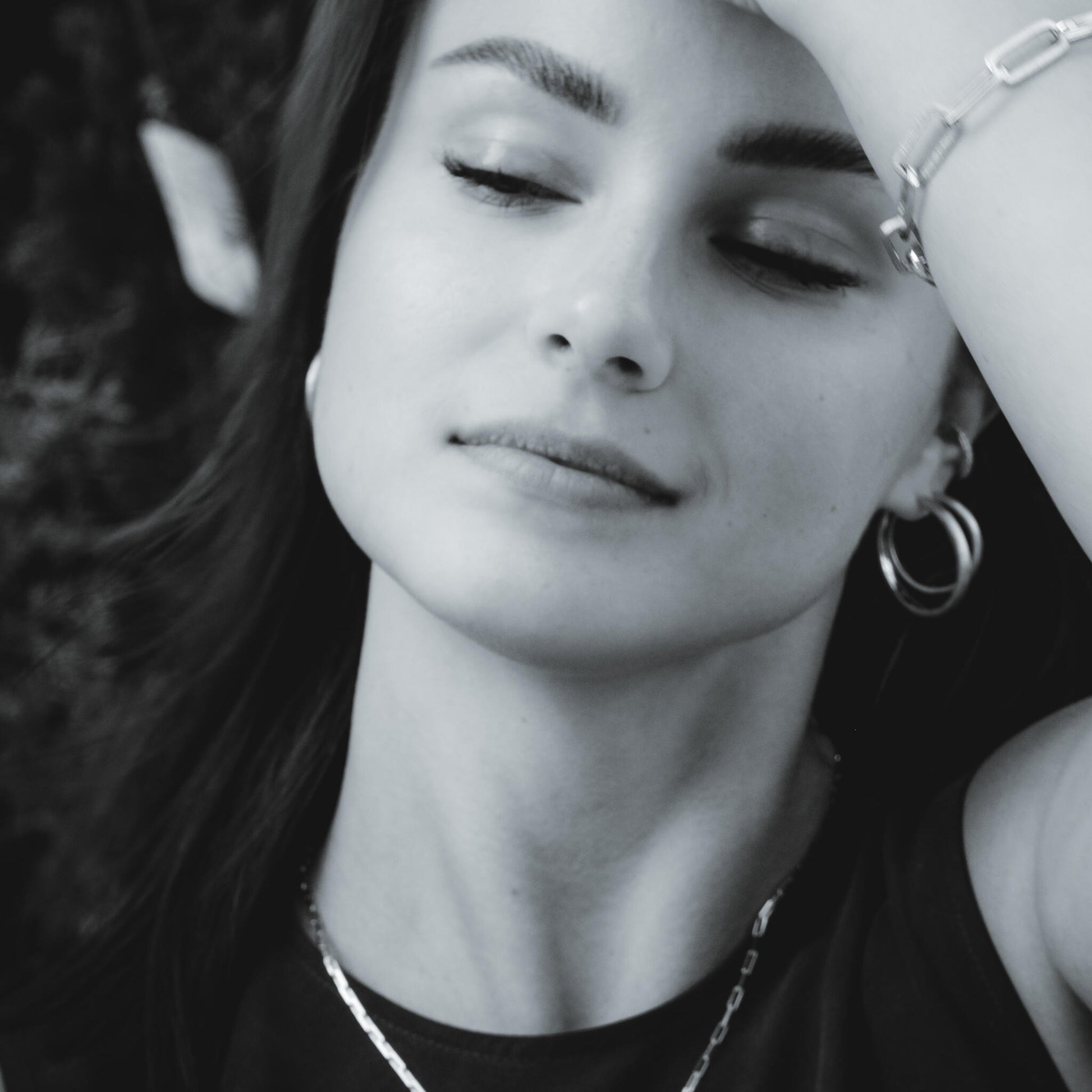 soft rose gold sugar hoop l earrings with a brushed texture and polished inner curve