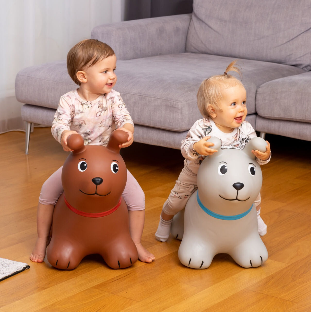 soft brown dog jumpy toy for toddlers, sitting on a cozy nursery rug