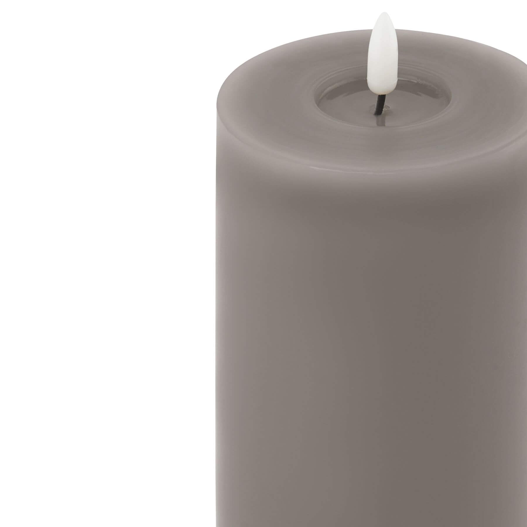Grey LED wax candle with realistic melt effect and flickering flame, 23cm tall, battery-operated for safe ambiance by sostter at brixbailey.com
