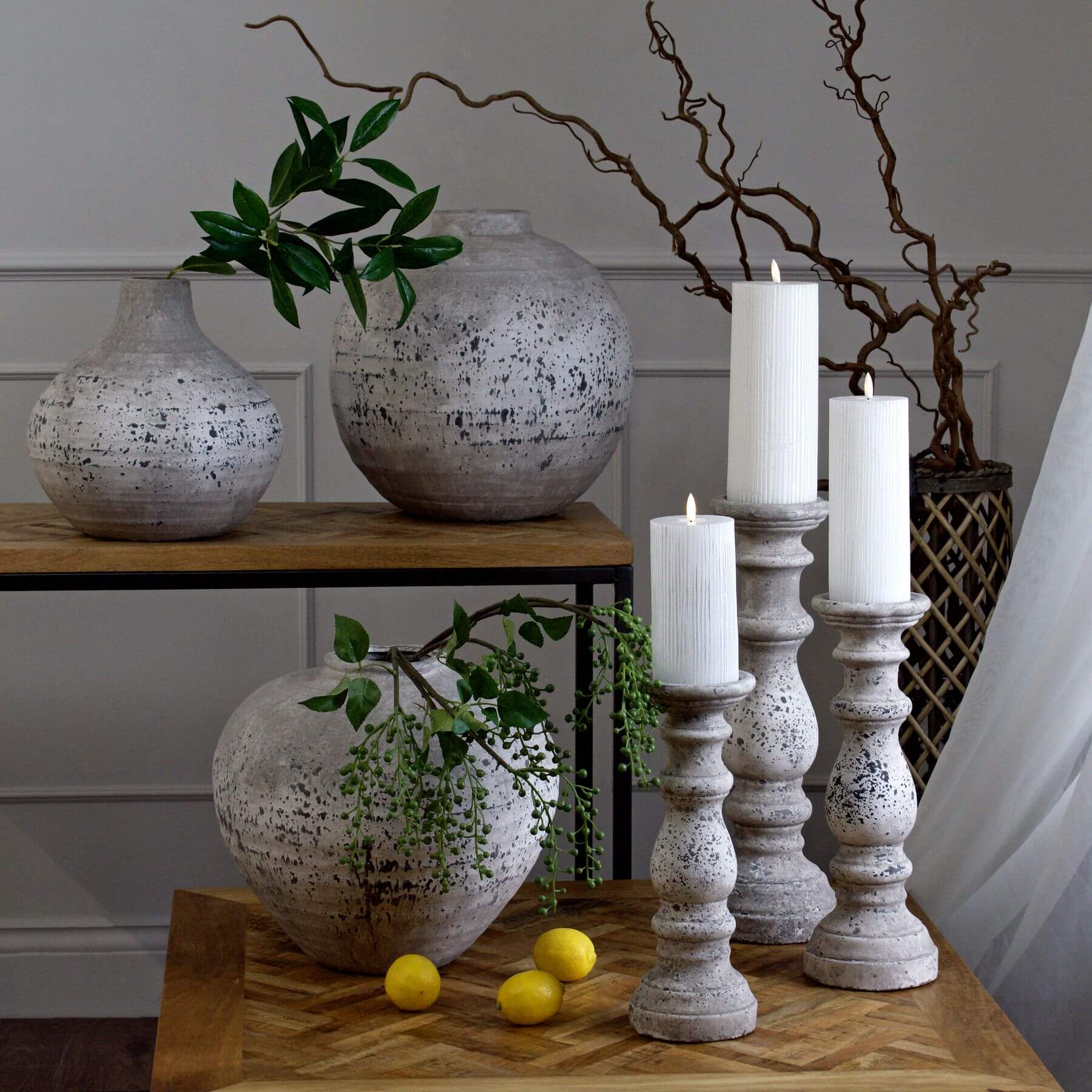 Handcrafted ceramic column candle holder with stone-effect texture in natural neutral, 31cm tall, for ambient lighting. by sostter at brixbailey.com