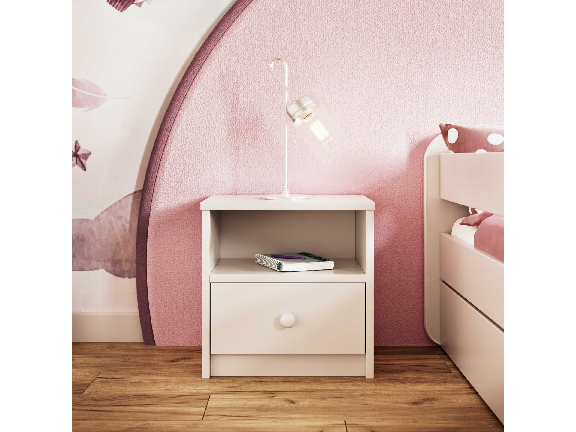 a playful pink bedside table for kids with an open shelf and drawer in a bright, fun room