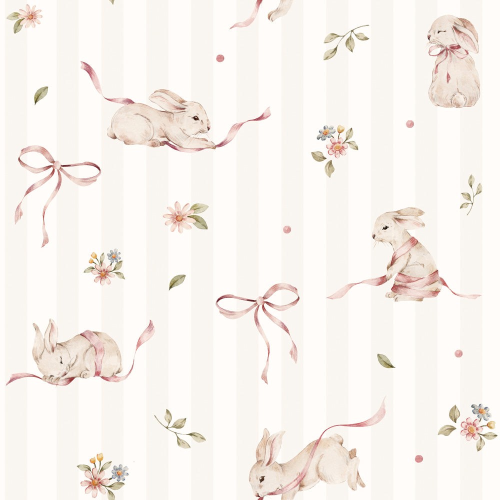 artisan-made pink rabbits on stripes wallpaper roll leaning against a nursery wall