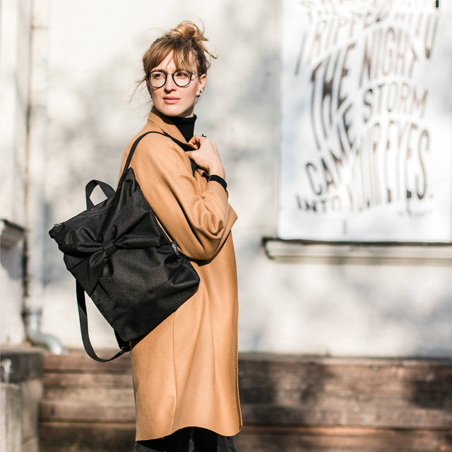 Elegant Black Bow Backpack – Waterproof & Organized by Muni at www.brixbailey.com