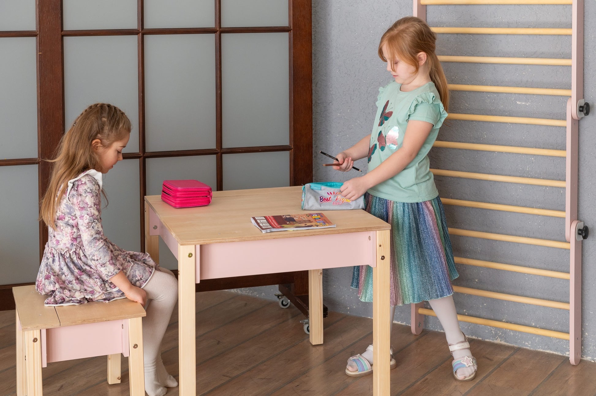 a functional kids table and chair set with storage for crafts and homework