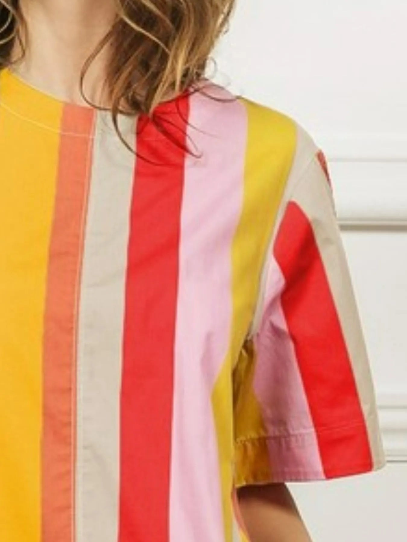 playful twirl in a vibrant rainbow stripe flared midi dress with side pockets