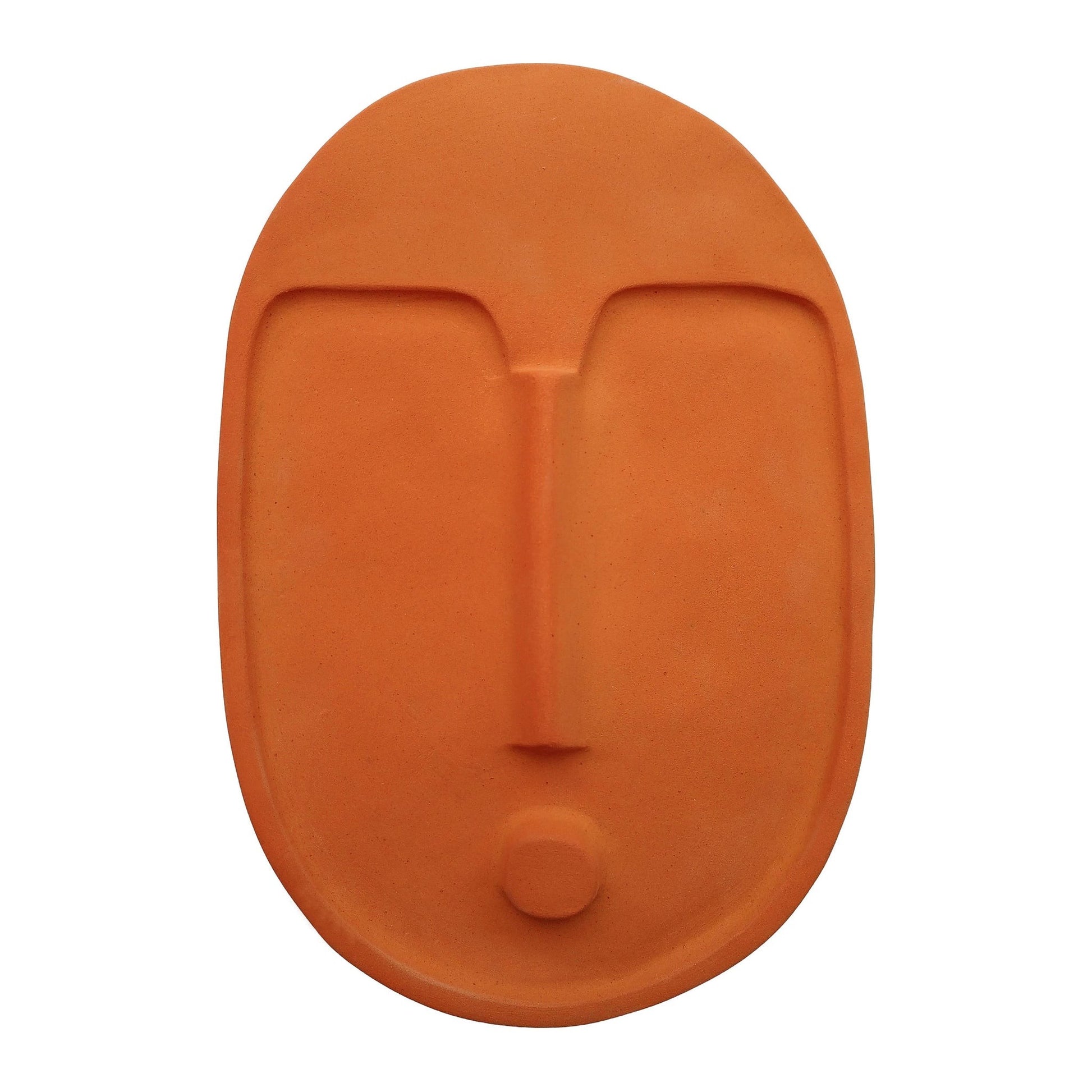 handcrafted portuguese terracotta wall mask in soft morning light