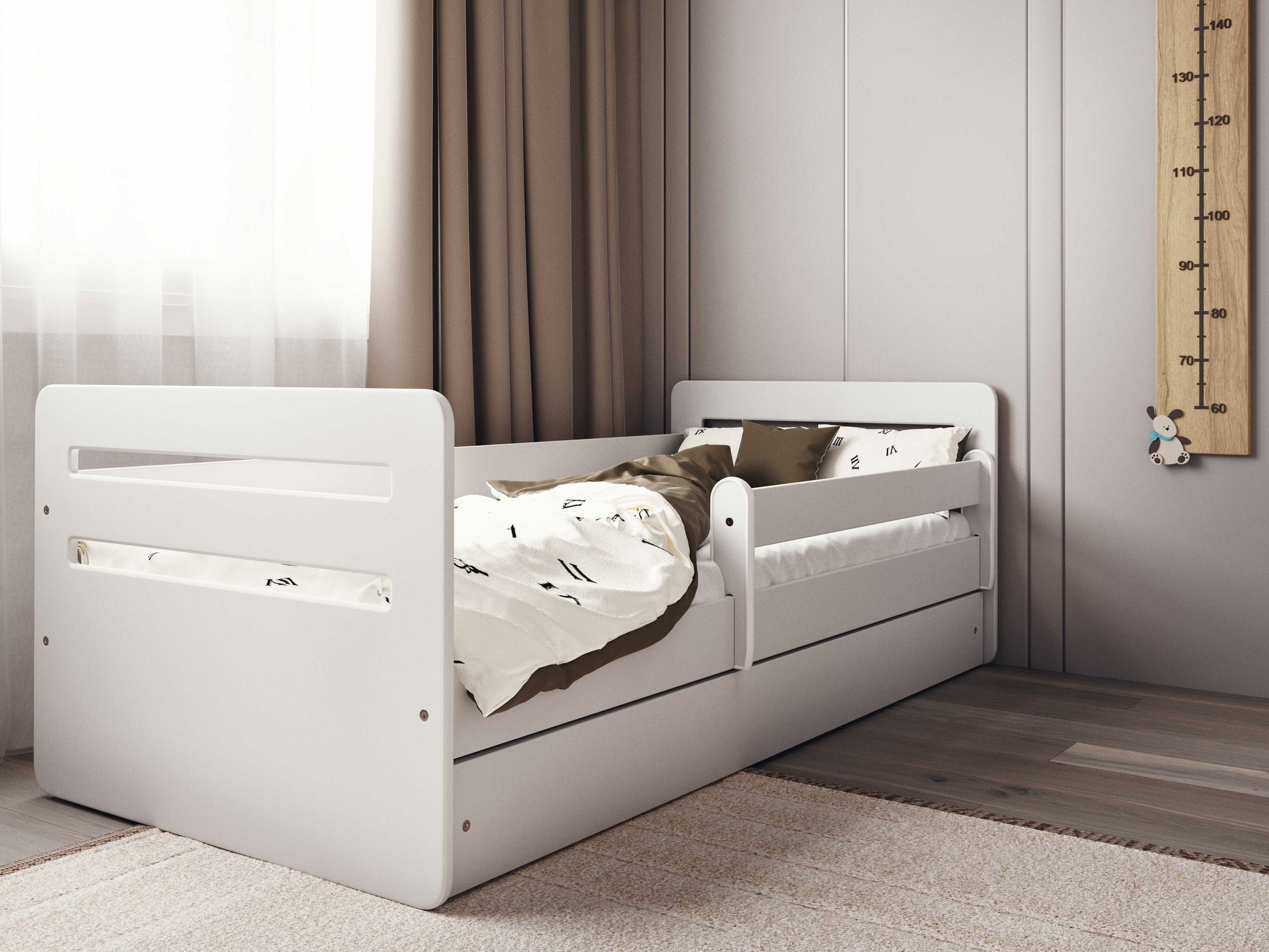 playful white tomi kids bed with a colorful toy box nearby in a sunny room