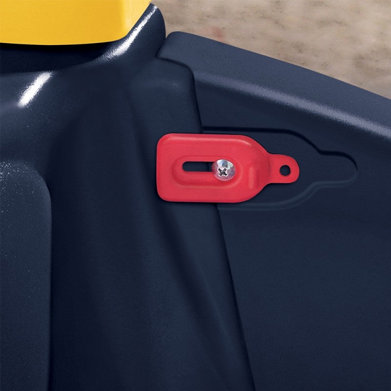 elegant side profile of a child in a black and yellow cozy truck ride-on toy