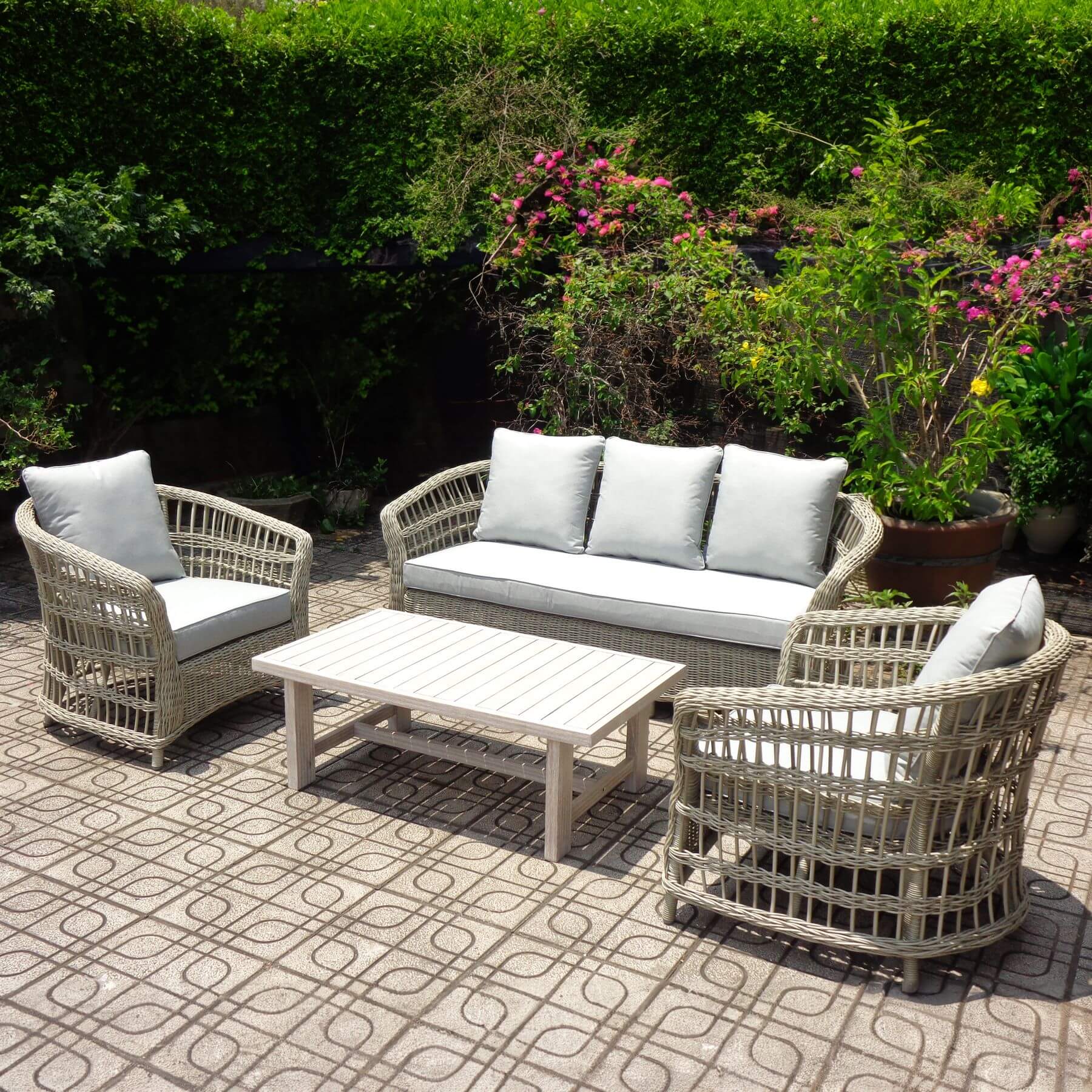 Beige outdoor furniture set with wicker weave, aluminum frame, acacia table, and Olefin cushions for patio or garden by Sostter at brixbailey.com