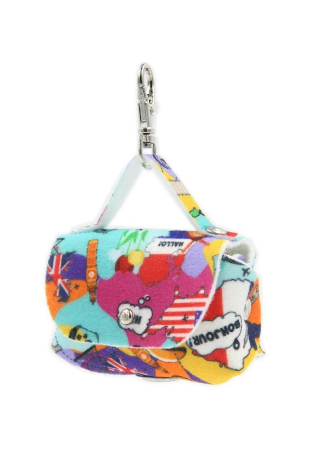 soft felt dog bag dispenser with a chic motif attached to a leash in warm morning light