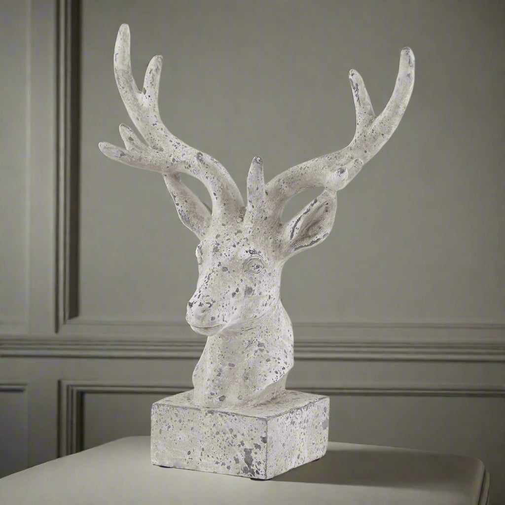 Handcrafted grey ceramic stag ornament with stone-effect finish and lifelike antlers for rustic home decor. by RoomLondon at brixbailey.com