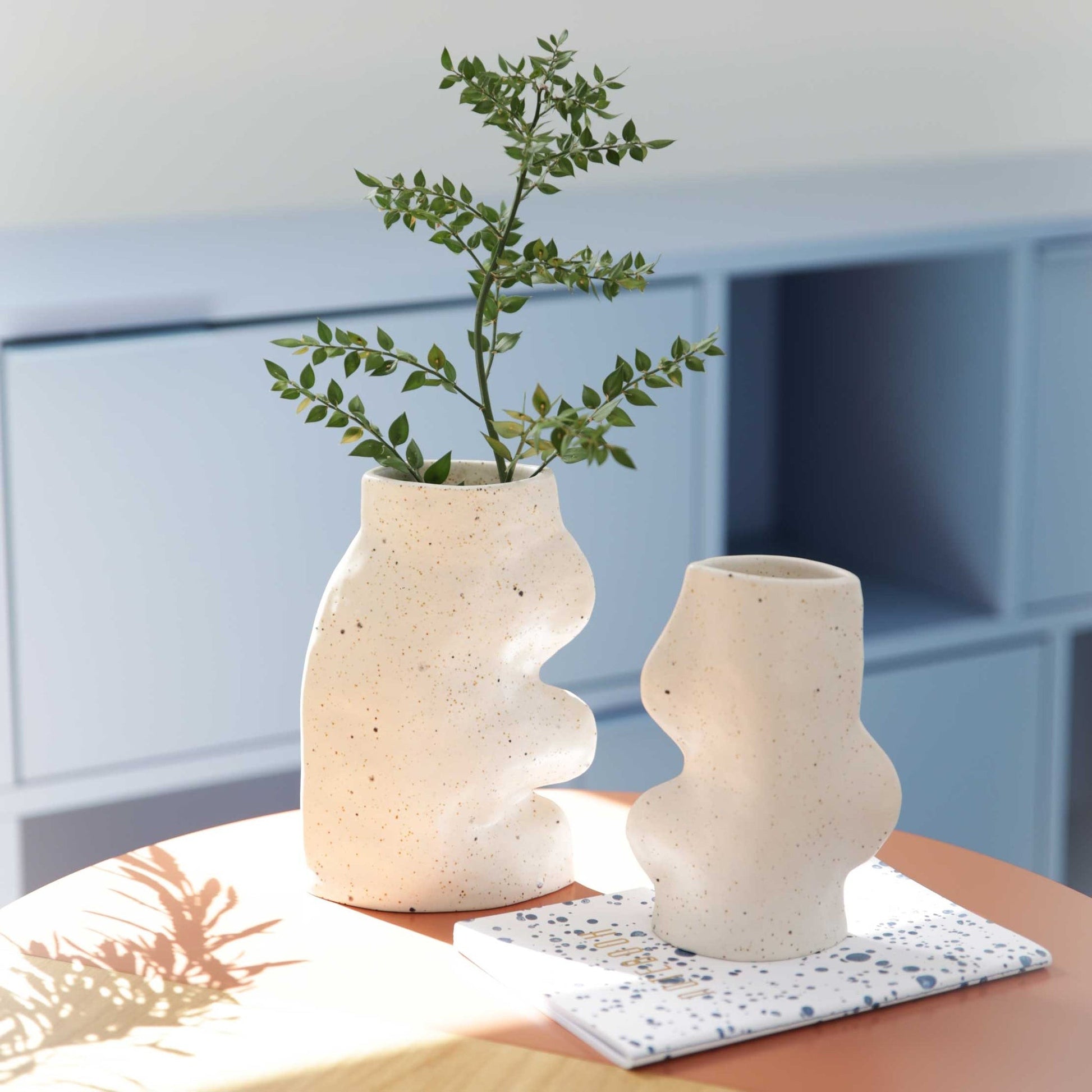 elegant large white fluxo ceramic vase with flowing lines in soft morning light