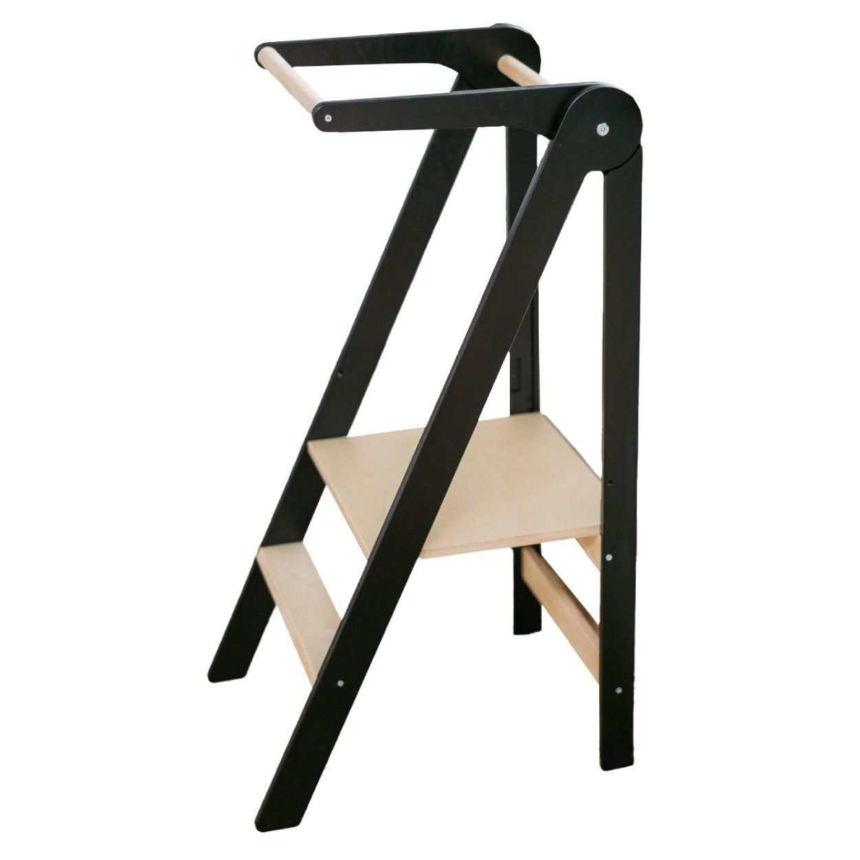 foldable kitchen helper tower in a bright playroom with morning light highlighting the birch wood grain