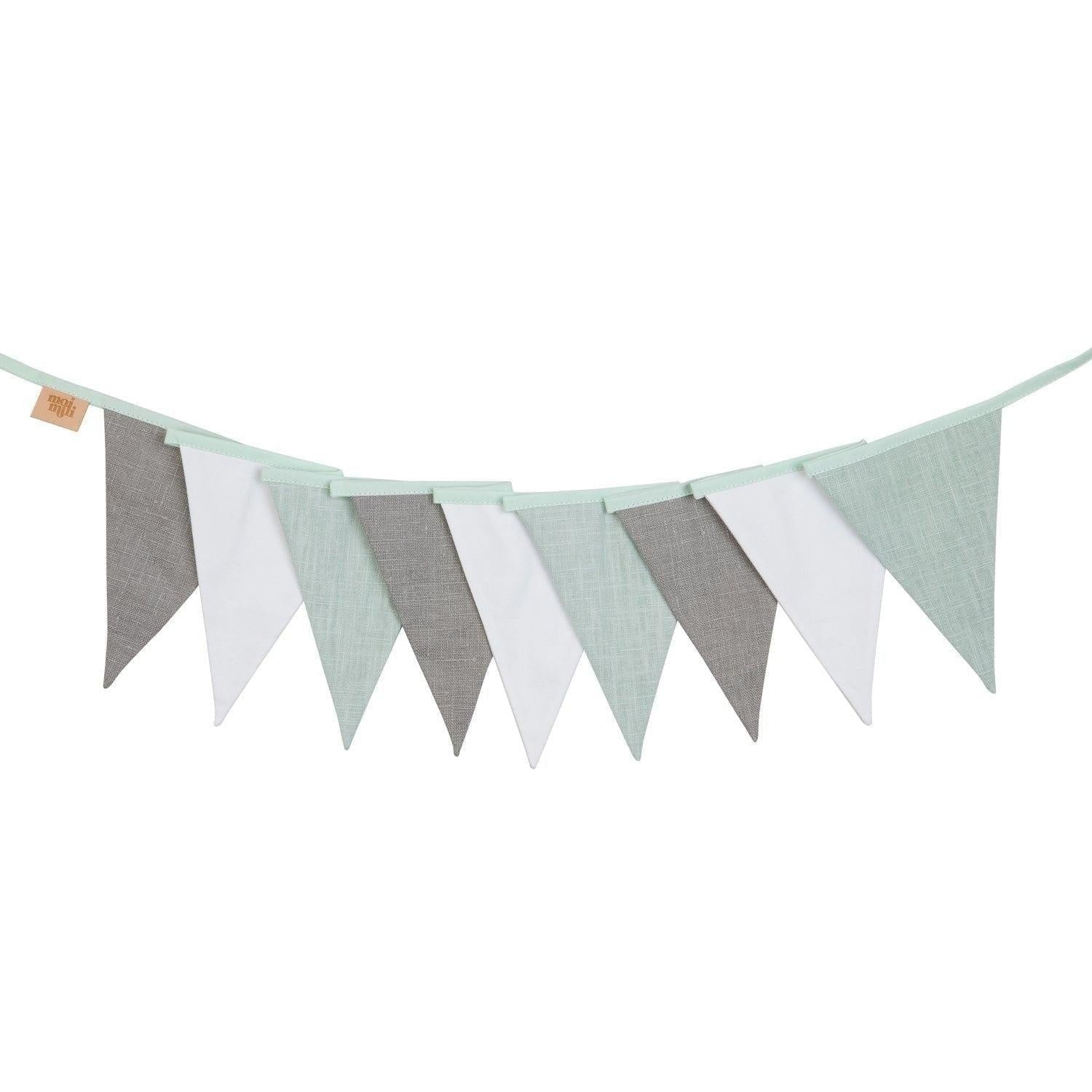 soft mint and grey linen garland draped gently over a cozy nursery crib