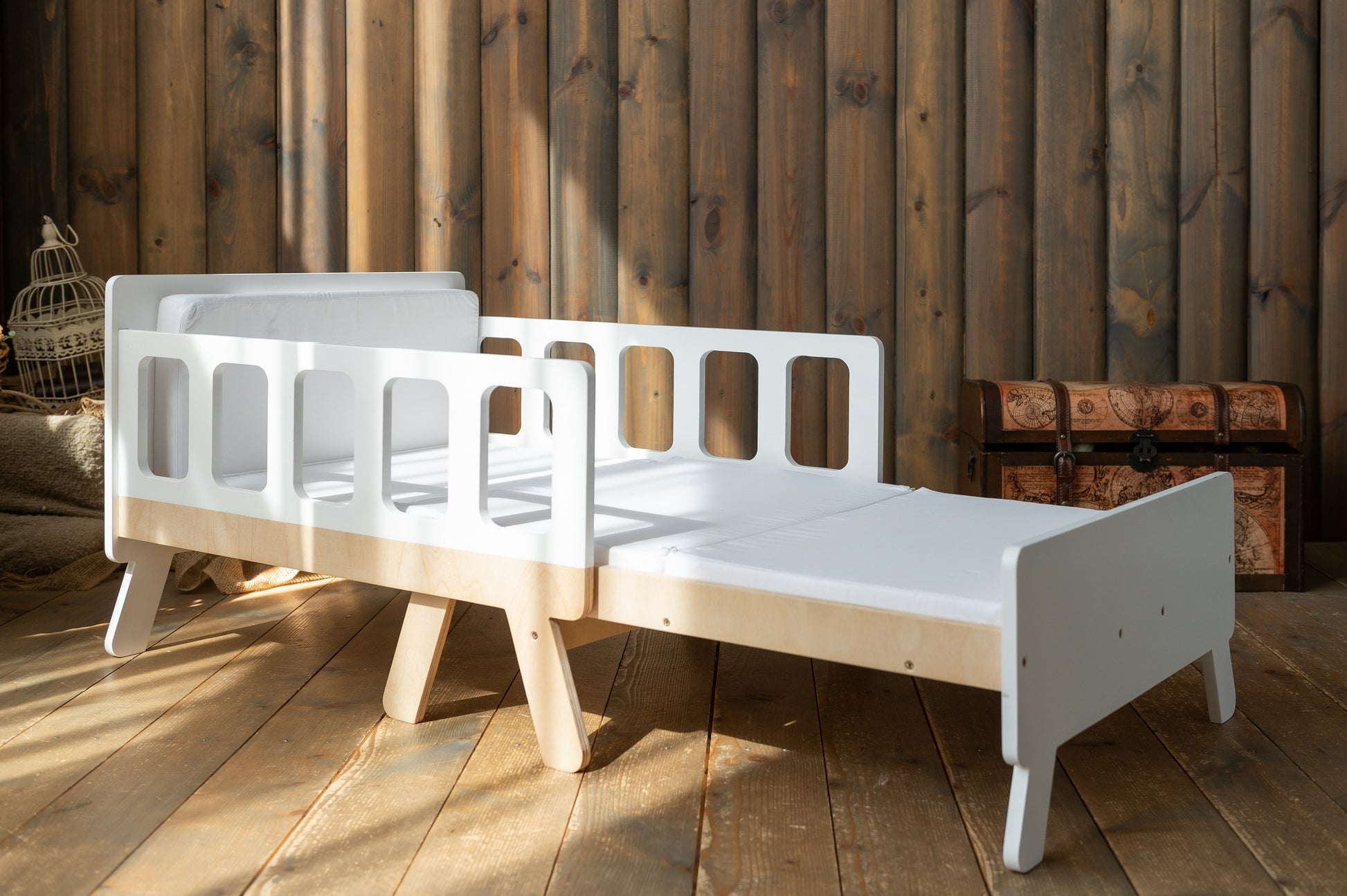 versatile kids growing bed in a warm morning light, showcasing its space-saving closed sofa mode