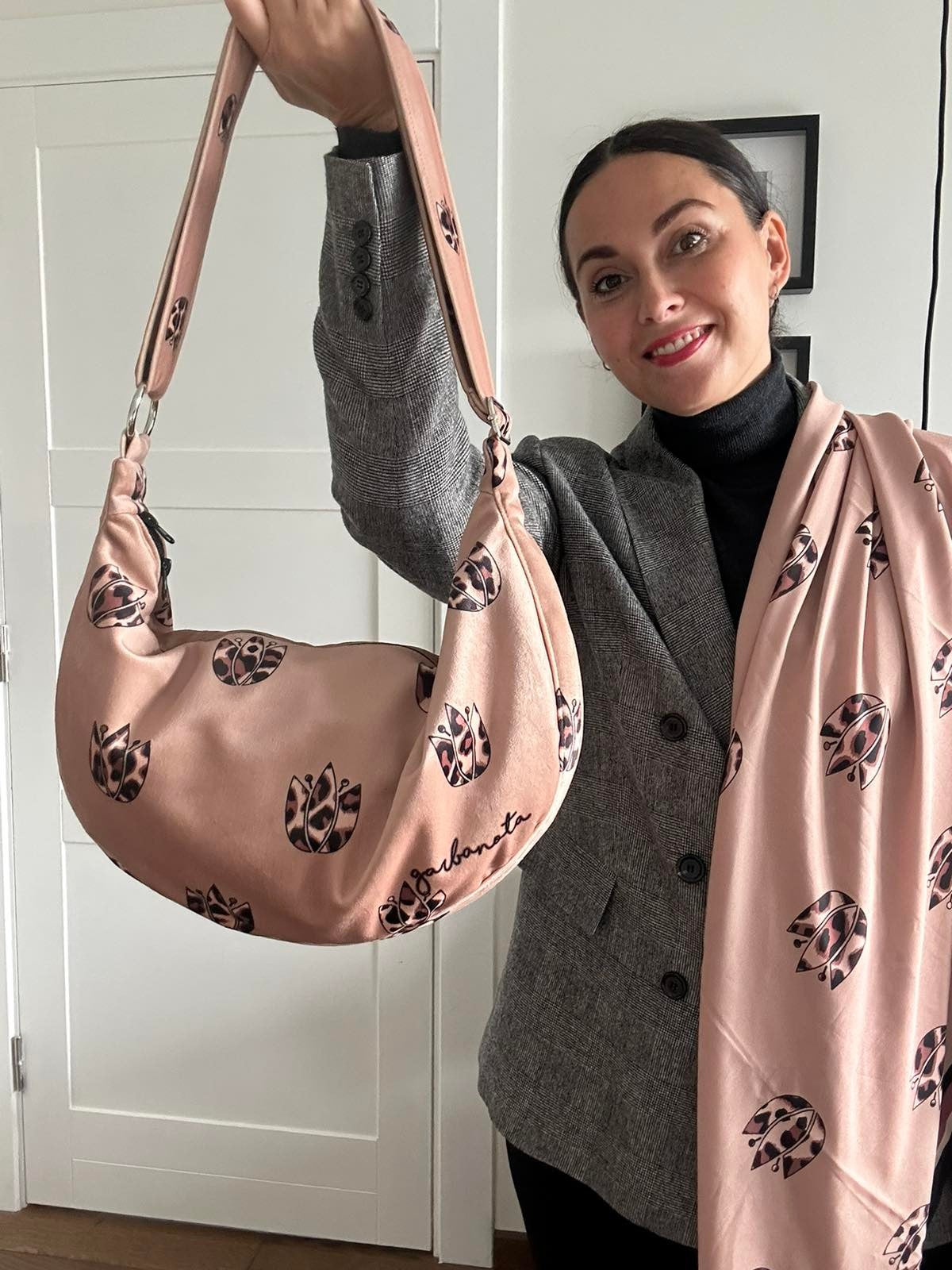 elegant brown leopard tulip hobo bag in soft velour, showcasing its chic slouch and sophisticated garbanota lining