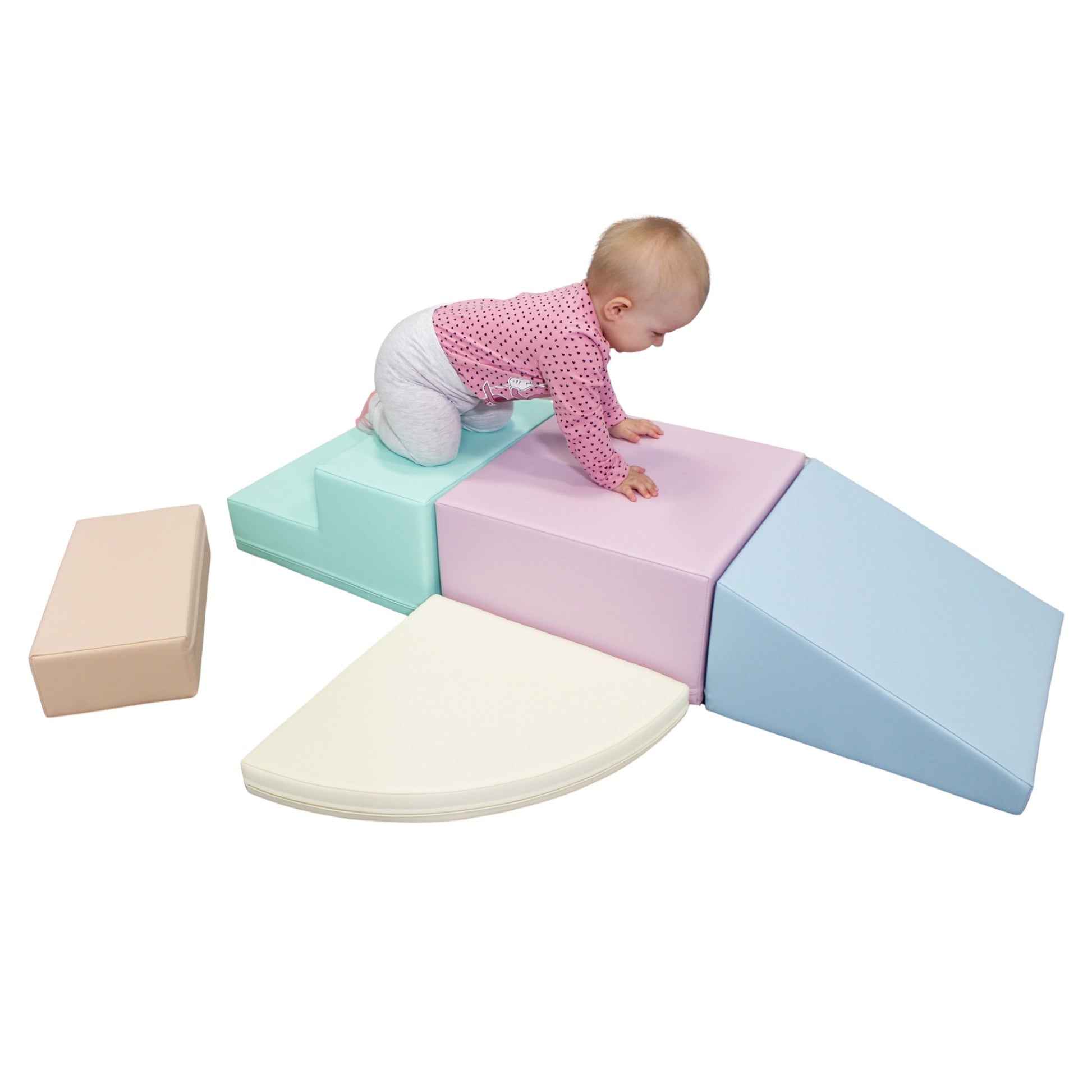 a child climbing on a soft pastel foam block corner climber in a sunlit playroom