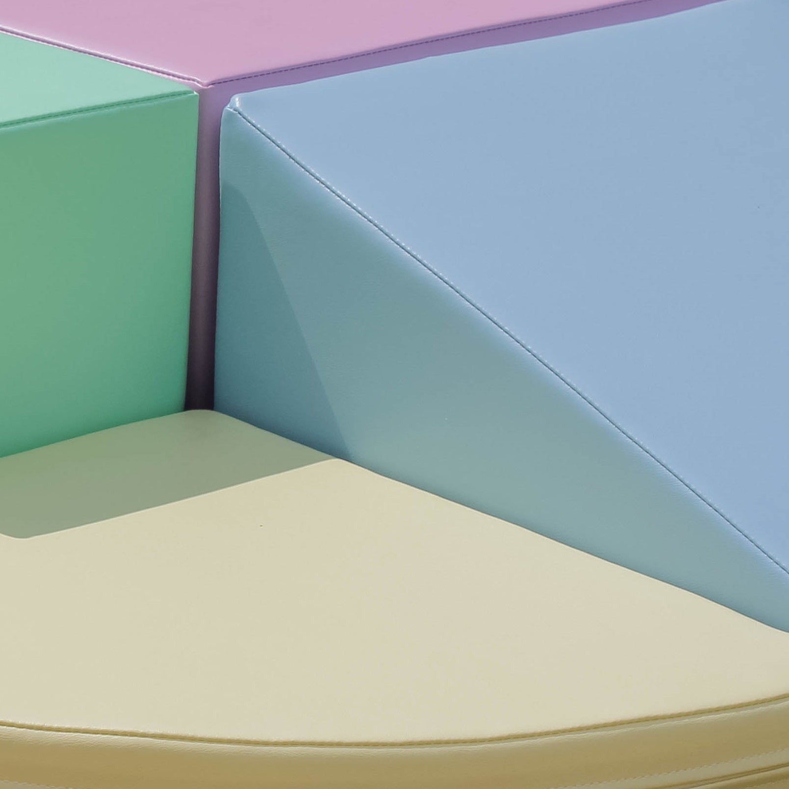 pastel foam climber blocks set up in a cozy nursery corner for toddler play