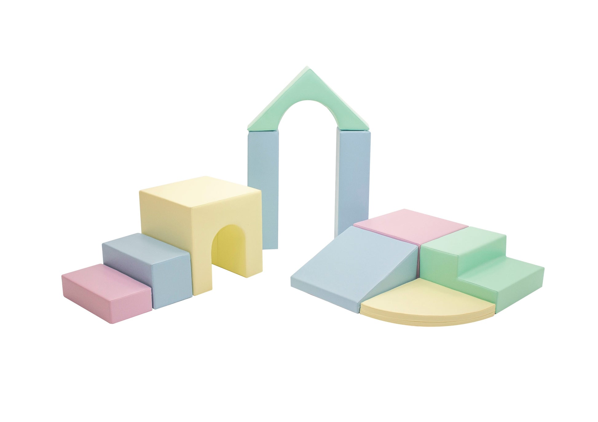 a child's hand reaching for a soft pastel foam block from the iglu playset