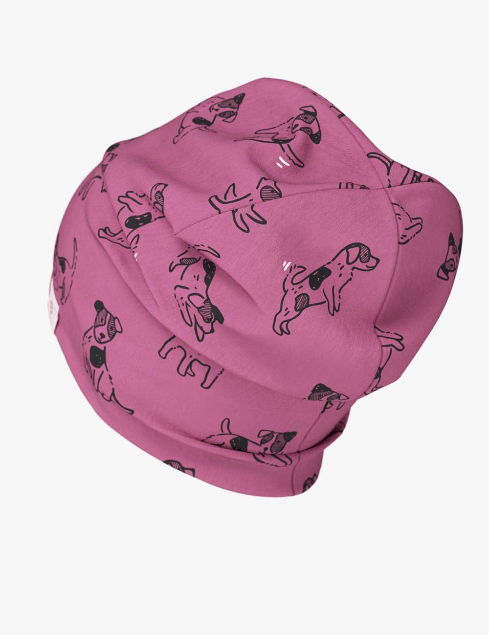 a soft pink dog beanie for kids shown in gentle morning light, folded for a snug fit