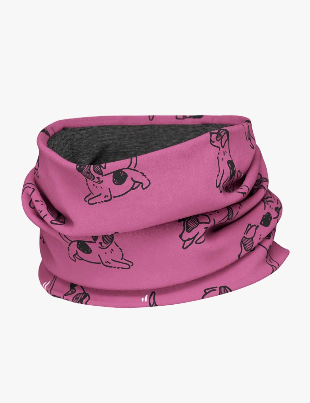 a child laughing while wearing a pink dogs merino neck tube in a sunlit garden