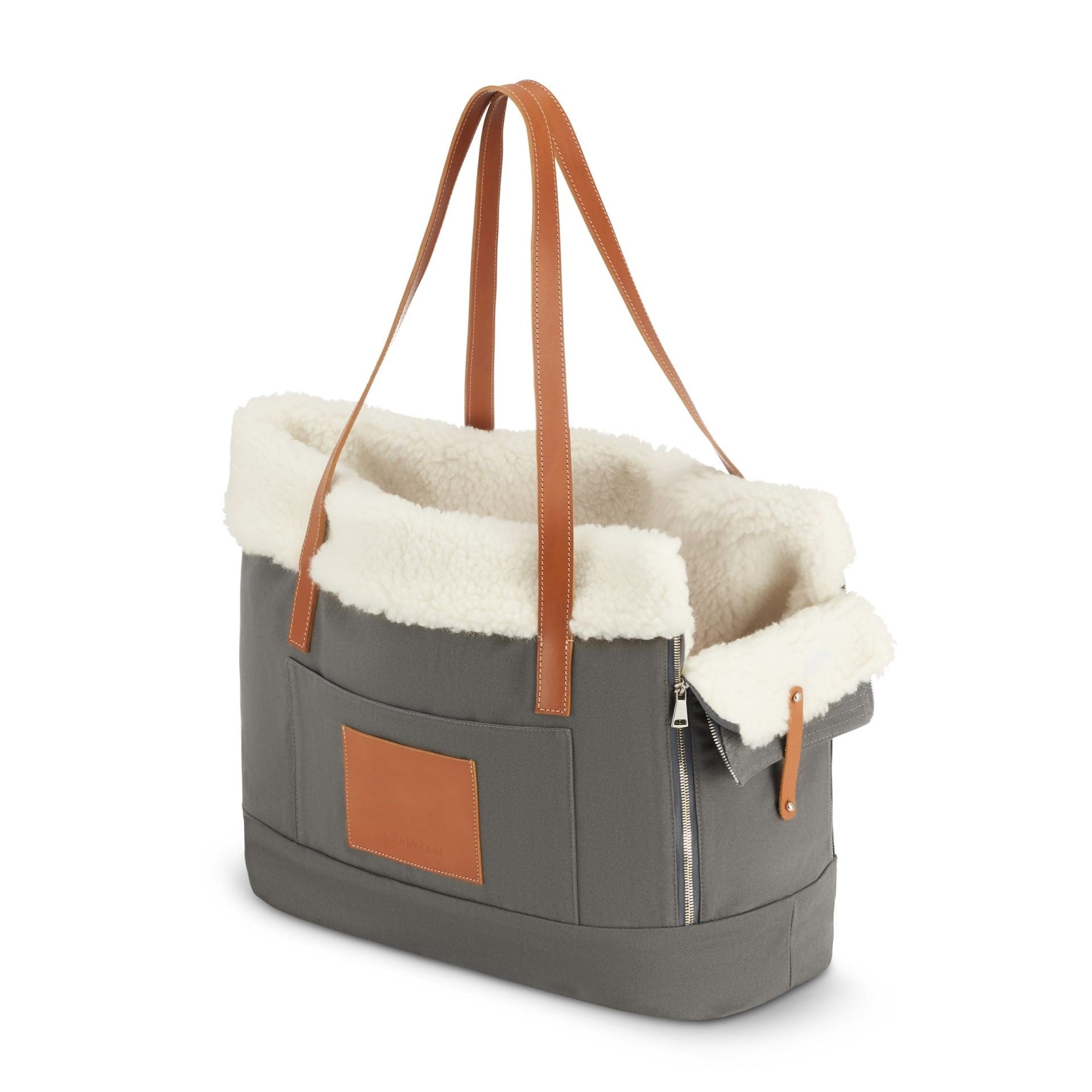playful grey liiva dog carrier with a happy small dog peeking out from the top