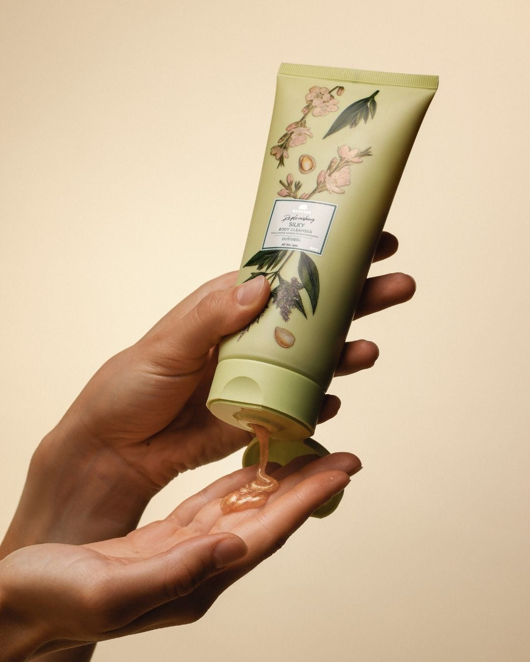 bold golden shimmer of magrada x lauren moisturizing shower gel with cucumber extract, glowing under warm light