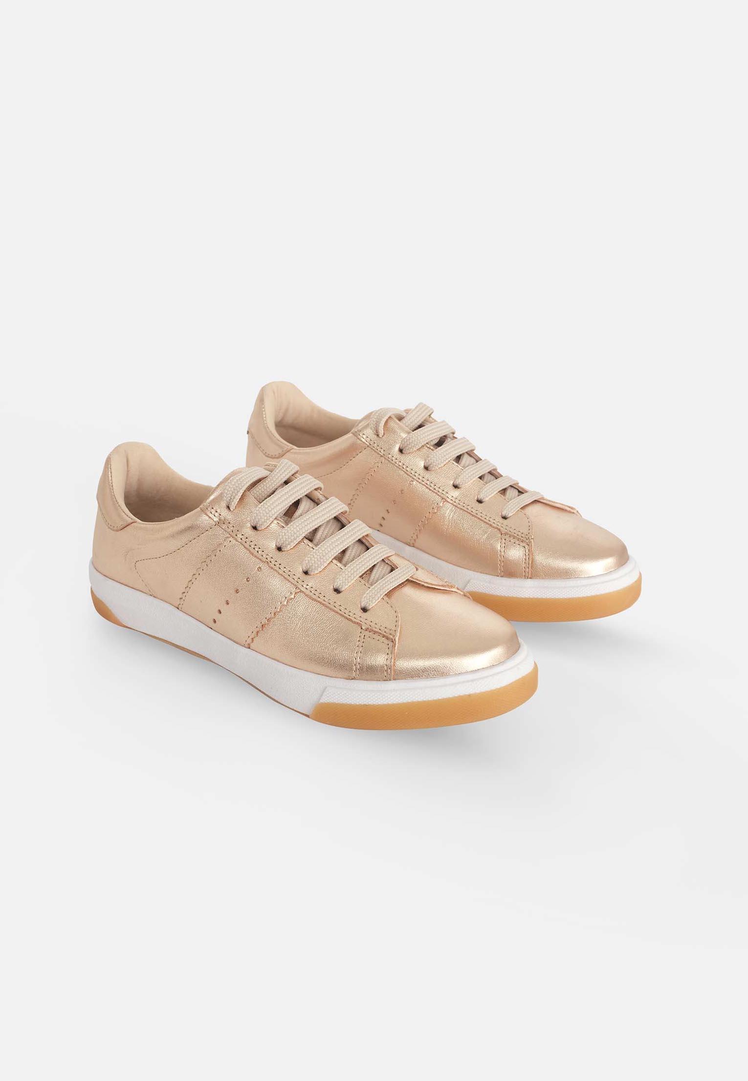 soft golden leather sneakers with a comfortable padded tongue and secure lace-up front