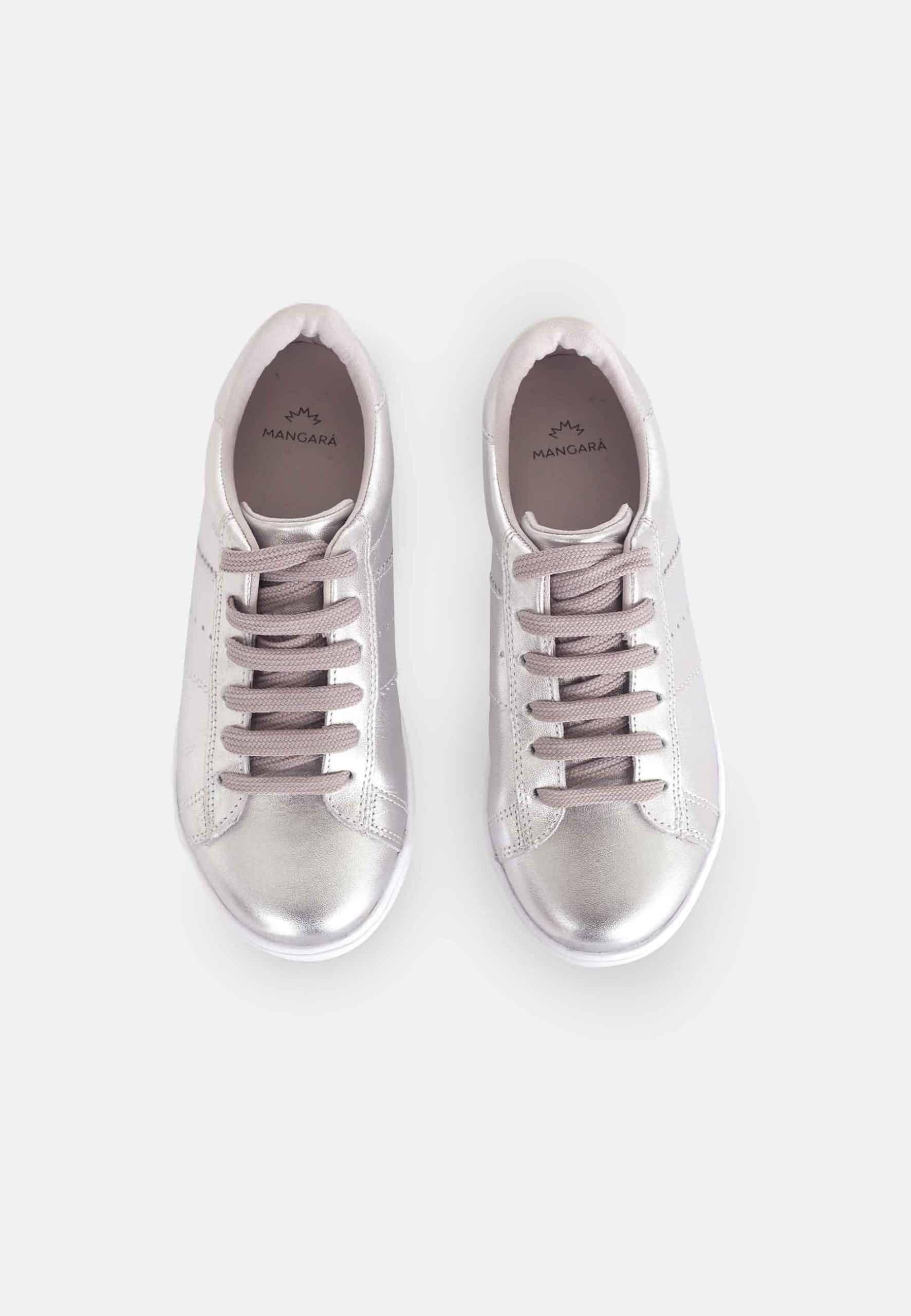 playful metallic silver sneakers catching the light on a fun day out