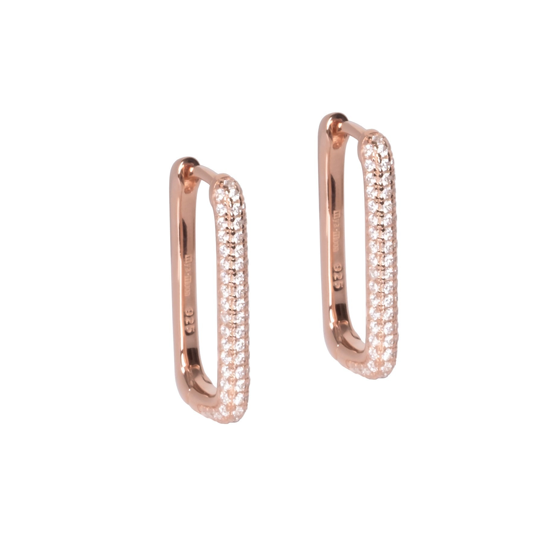 playful close-up of sterling silver hoop earrings with sparkling white zircons catching the light