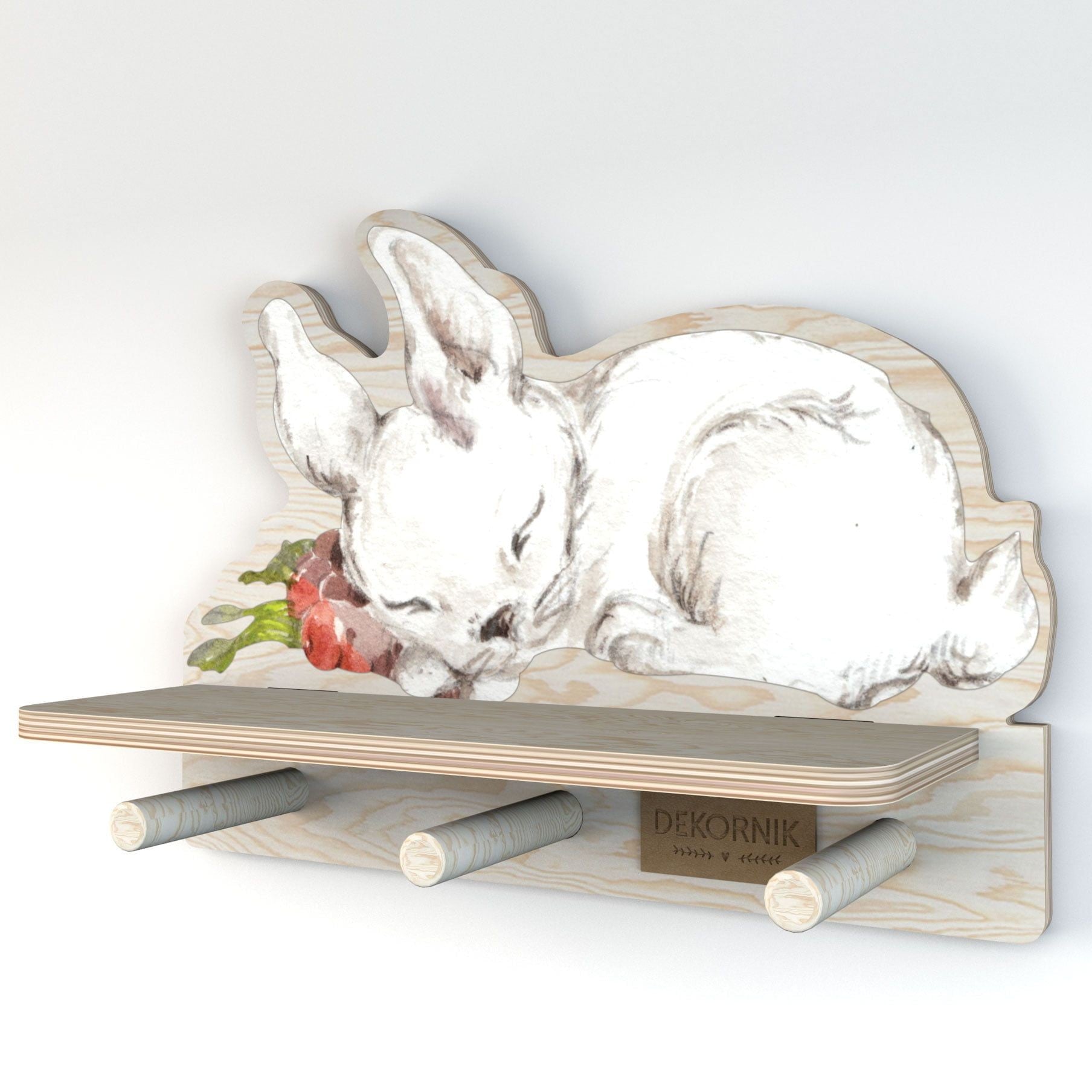 a soft-lit view of the charming rabbit wall shelf holding a small teddy bear and necklace