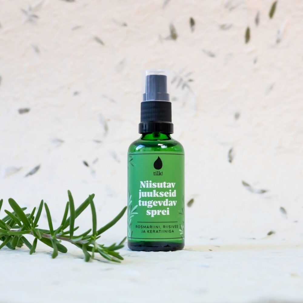 bold close-up of vegan hair spray bottle with rosemary hydrosol and rice water, glowing under golden light
