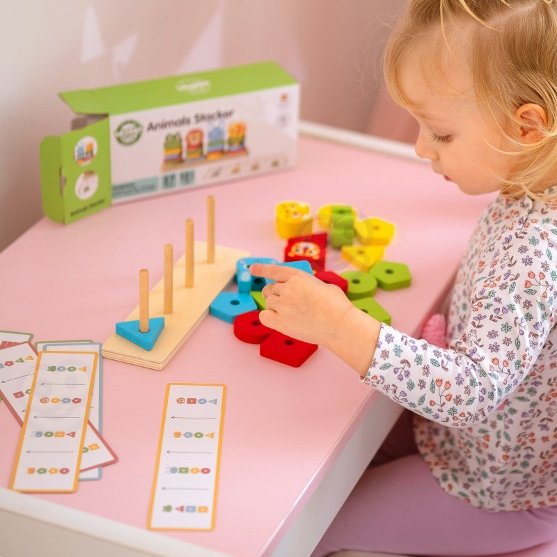 functional montessori animal puzzle pyramid with all 27 wooden pieces neatly arranged on a table