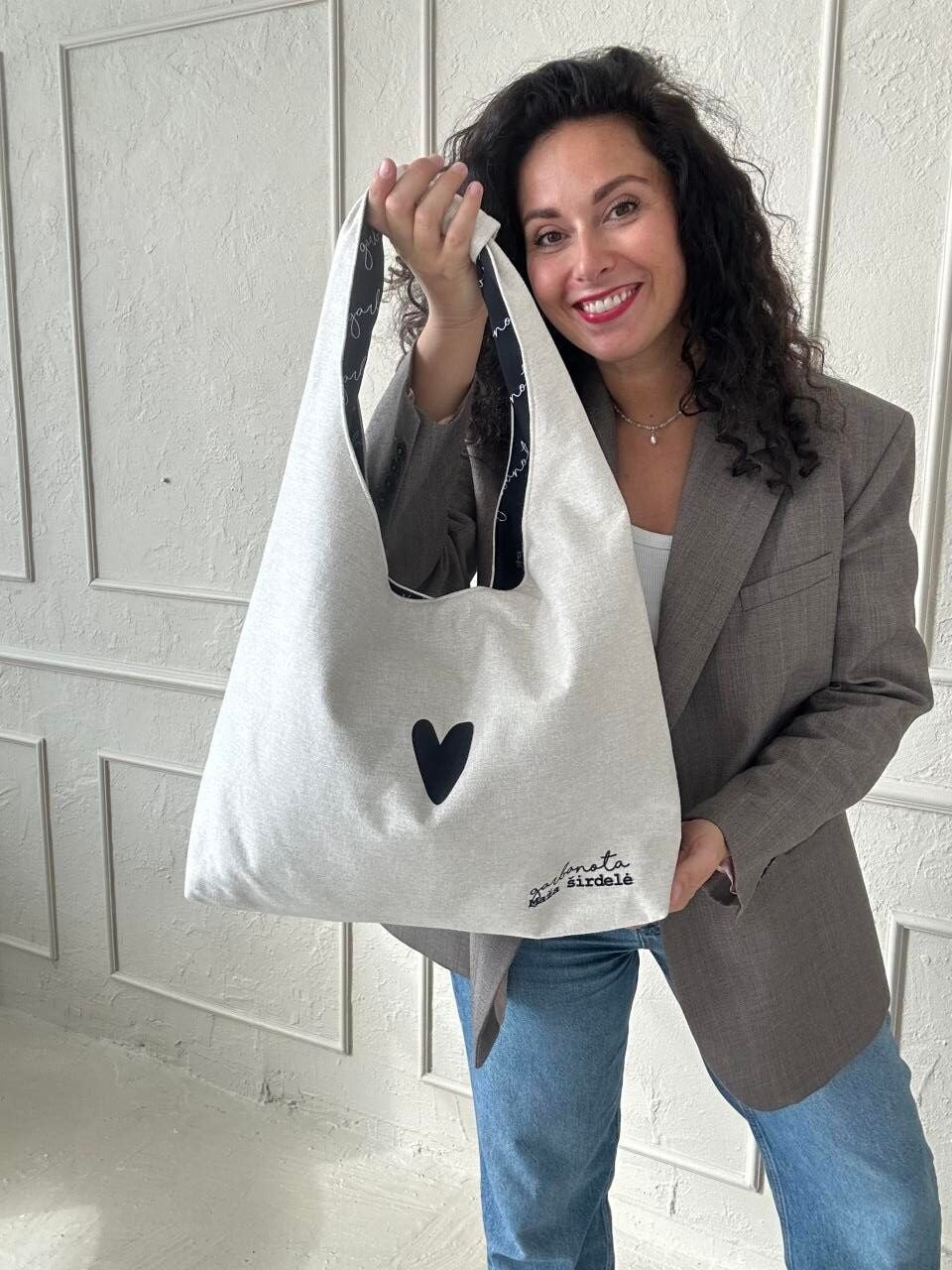 soft white moon bag heart held gently with its chic garbanota lining visible