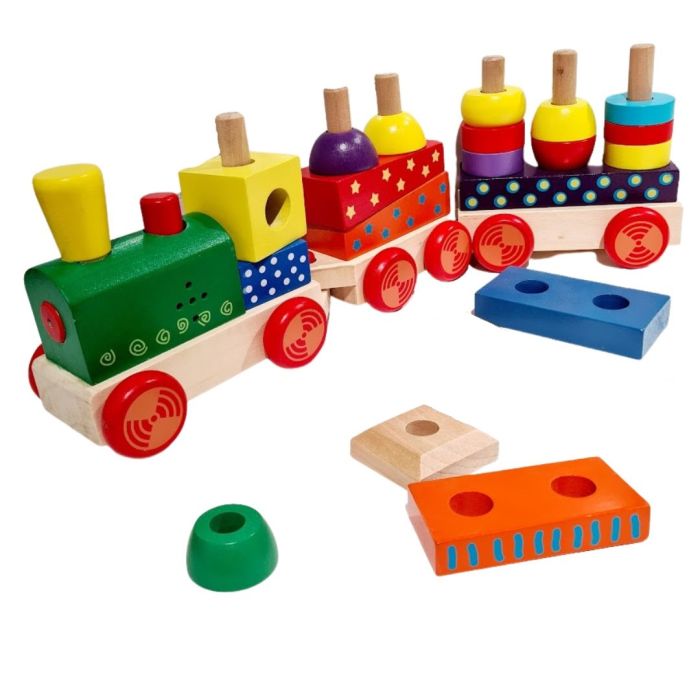 a child's hand pressing the button on the colorful wooden block train to make it choo-choo