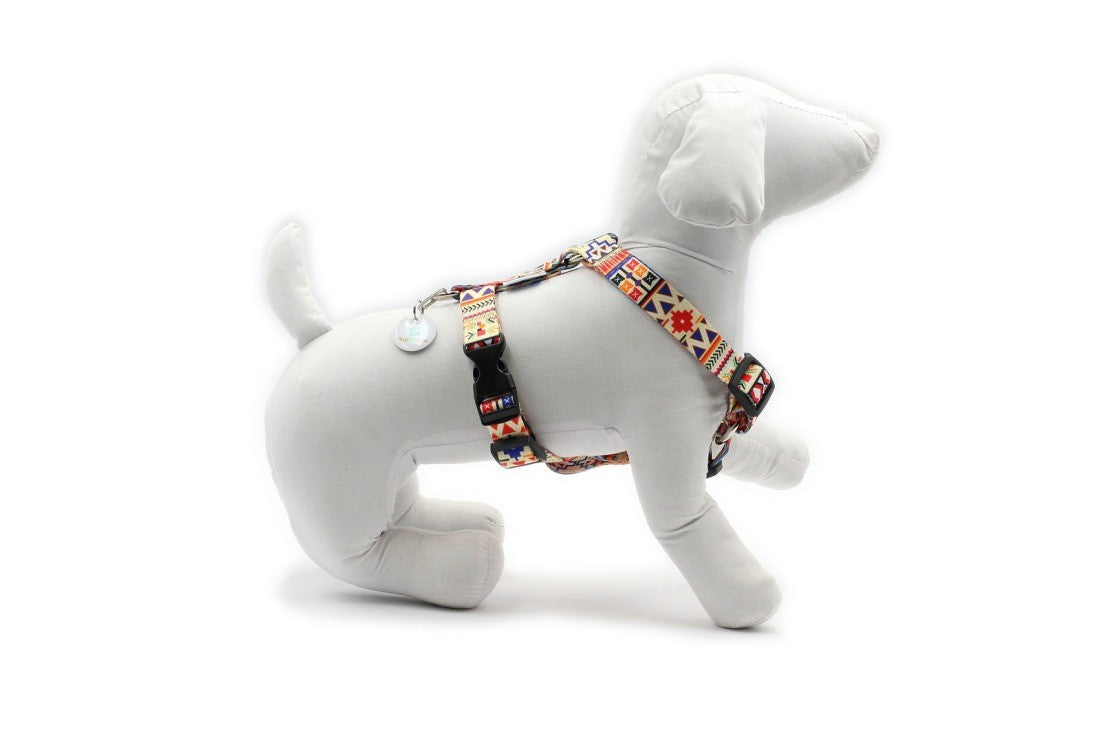 elegant boho dog harness with nickel-plated fittings on a refined grey background