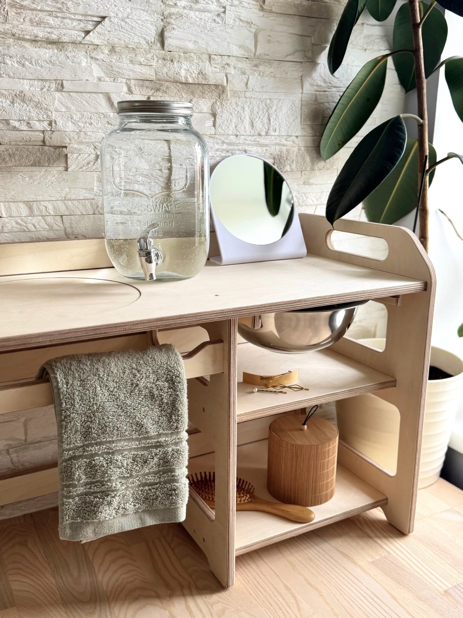 montessori wooden washbasin for toddlers in a soft, natural light setting