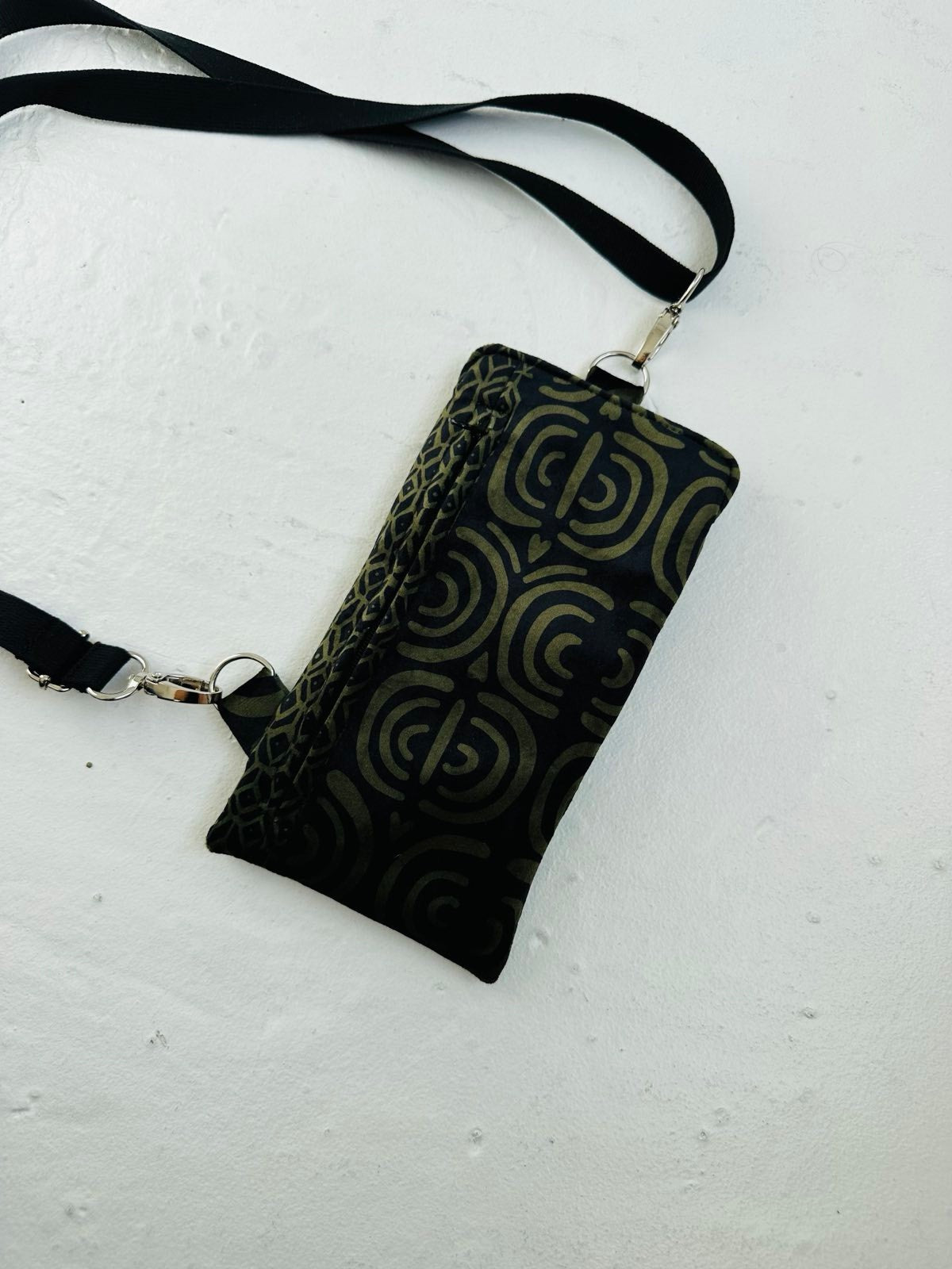 bold khaki velour phone bag with a striking metal clasp and front zip pocket