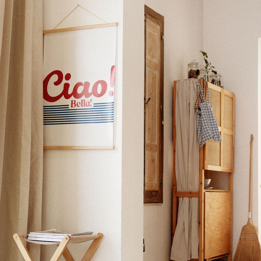 ciao bella poster 50x70cm on a clean workspace showing its practical size and matte finish