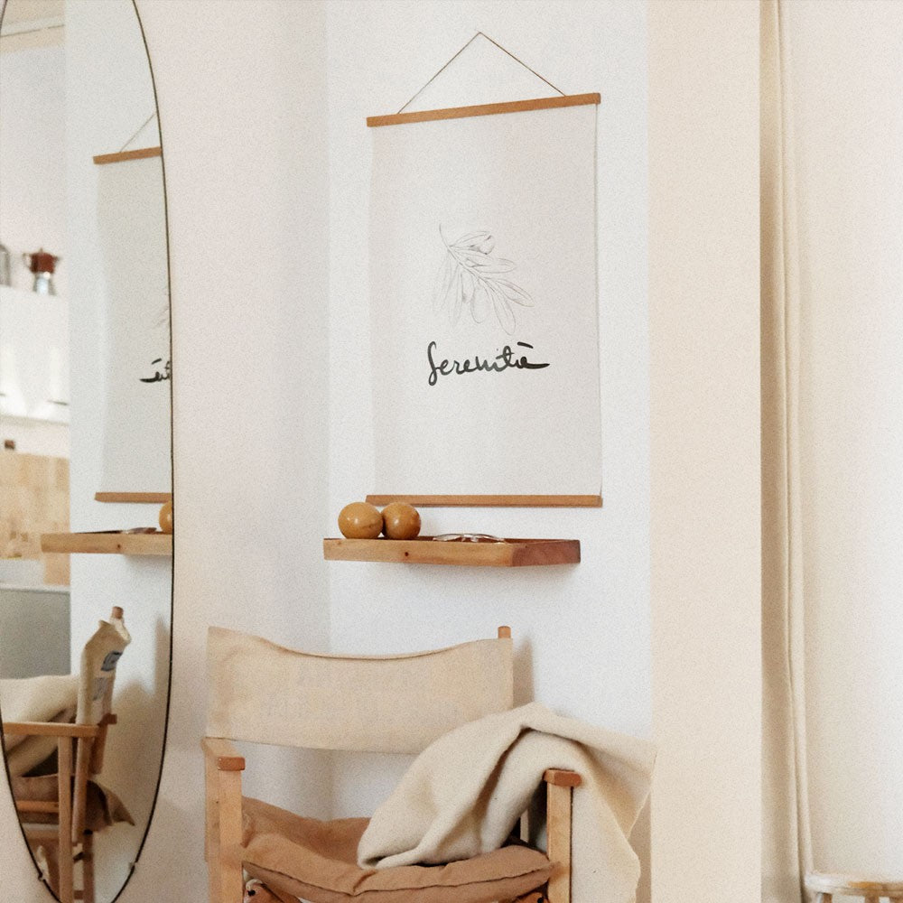 serenita poster 50x70cm on a clean workspace showing its practical matte finish and minimalist italian typography