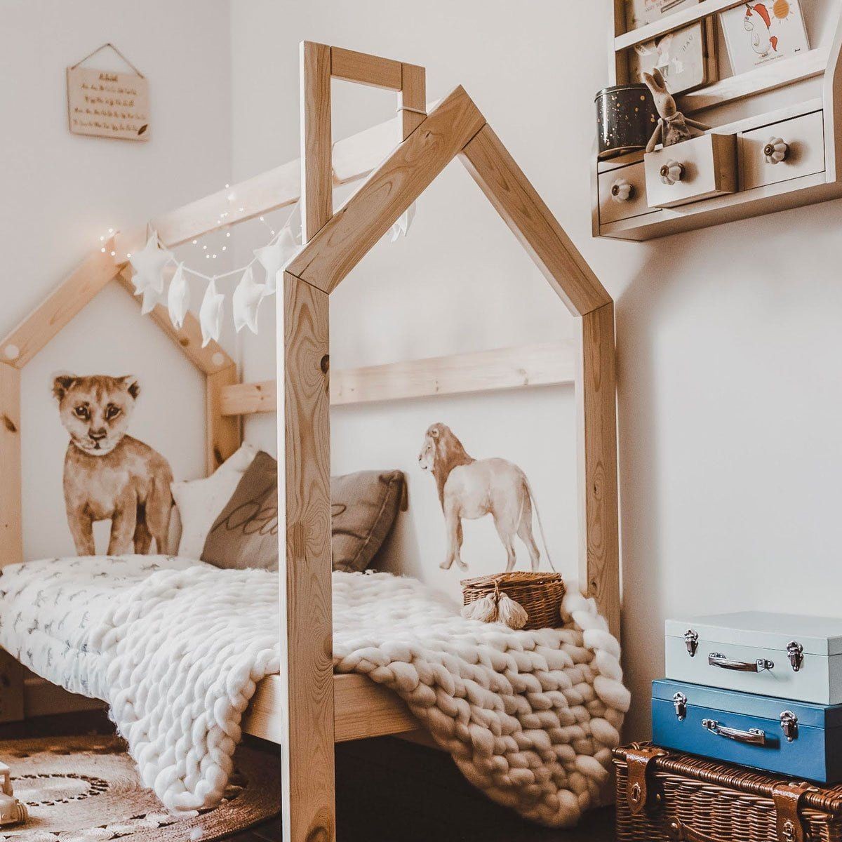 savanna wallstickers set in soft pastels - a close-up of the lemur and toucan on a nursery wall