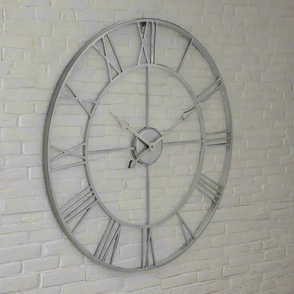 Silver skeleton wall clock with exposed mechanics, 70cm diameter, modern metal design for home or office decor by Sostter at brixbailey.com