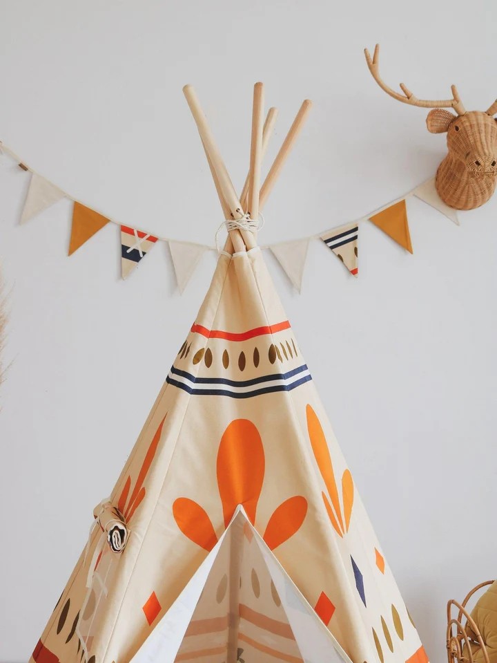 native vibe teepee tent with bold geometric prints, sturdy pine poles, and cotton cover, ready for adventure