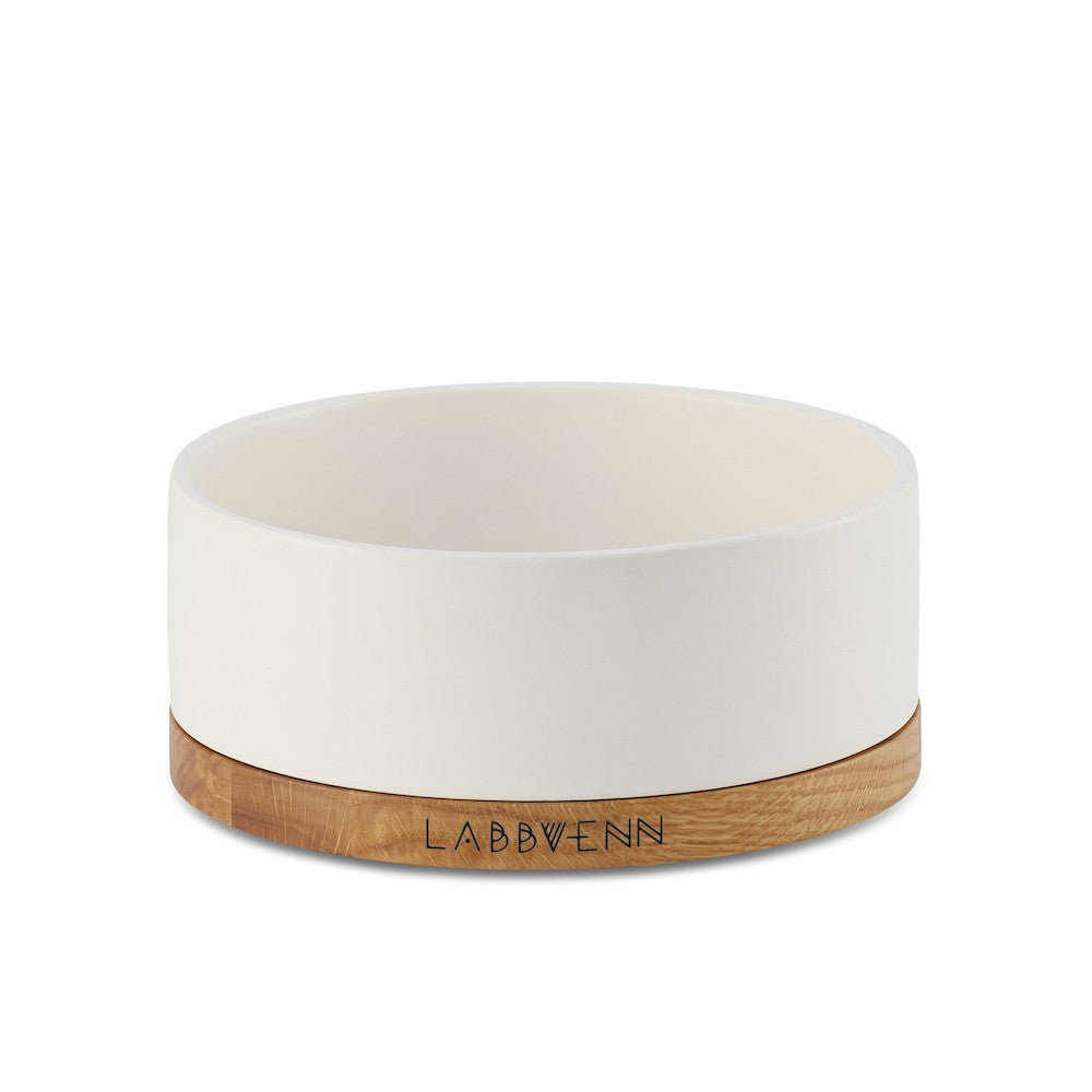 bold statement white ceramic pet bowl on a rich oak stand, elevated dining